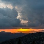 "Reappearing Sun over Cowee Mountains" by John MacLean Photography